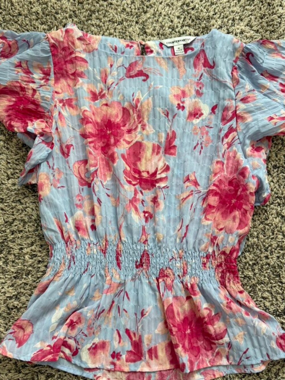 Blue and pink floral cinch peplum top